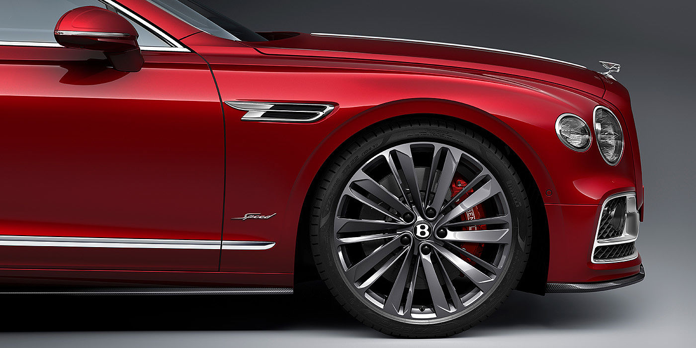 Bentley Athens Bentley Flying Spur Speed sedan front wheel in close up with Dragon Red II paint