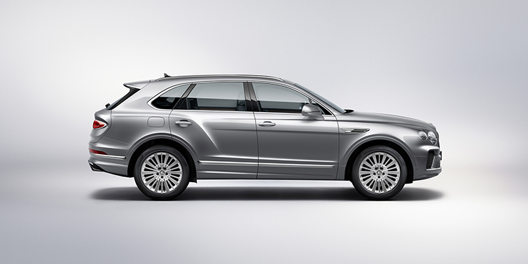 Bentley Athens Bentley Bentayga SUV side profile in Moonbeam silver paint against white background featuring 21 inch 5 spoke wheels